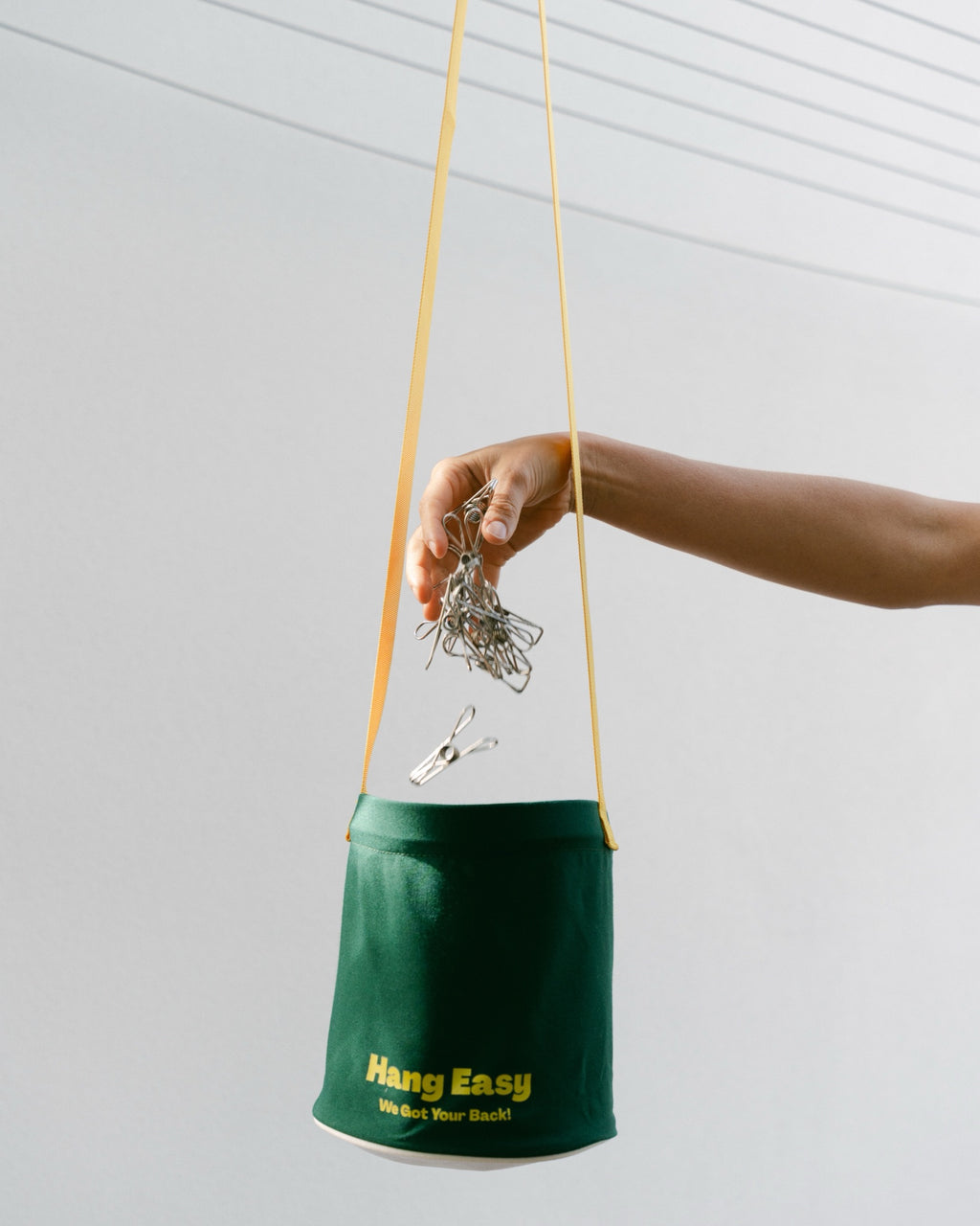 Dropping stainless steel pegs into the Hang Easy Peg Bag