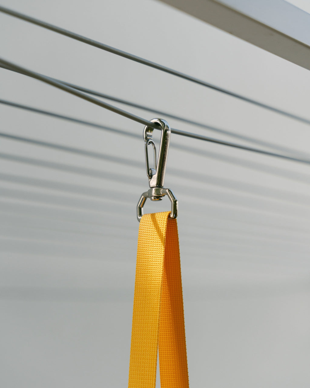 Close-up of the Hang Easy Peg Bag's marine-grade stainless steel clip on the clothesline