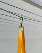 Close-up of the Hang Easy Peg Bag's marine-grade stainless steel clip on the clothesline